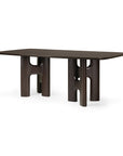 Ethnicraft Flow Dining Table in Mahogany Rose Brown, featuring a rectangular solid wood top with two sculptural, curved pedestal bases.