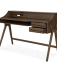 The Flow Desk by Ethnicraft is a modern wooden desk, perfect for contemporary workspaces. It features angled legs, two small right-side drawers, a shelf above the desktop, and an integrated slot for cable management or organization. Crafted from solid mahogany with a rich dark finish, the Flow Desk adds sophistication to any environment.