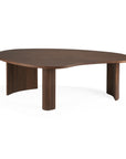 The Ethnicraft Boomerang Coffee Table features an organic, kidney-shaped FSC-certified teak top with a smooth, dark brown varnish and three sturdy, vertically-grooved legs for a unique contemporary look.