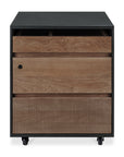 The Ethnicraft Oscar Drawer Unit - Teak - Black features a black frame, two natural wood grain drawers, a solid teak textured bottom drawer, and four small wheels.