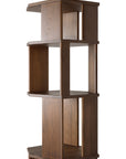 The Ethnicraft Stairs Column - Teak is a tall, modern shelving unit with an open, geometric design and staggered shelves split by vertical panels. Made from FSC-certified teak, it boasts a warm, medium-brown finish.