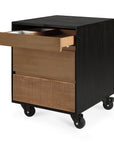 The Ethnicraft Oscar Drawer Unit - Teak - Black is a three-drawer filing cabinet with solid teak interiors and four caster wheels for easy mobility.