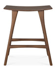 The Osso Counter Stool - Teak by Ethnicraft features a modern curved seat, four angled legs, and is crafted from FSC-certified teak for sustainability. Its smooth mid-century style and warm brown finish provide a sophisticated look.