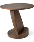 The Oblic Side Table - Teak by Ethnicraft is a modern wooden side table with a round top, angled central support, and matching base in dark teak, featuring a sculptural geometric design inspired by Ethnicraft.
