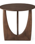 The Ethnicraft Geometric Side Table features a smooth, solid varnished teak top and a distinctive open geometric base with two curved, angled legs. The rich dark brown finish highlights its unique design.