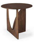 Ethnicraft’s Geometric Side Table in varnished teak features a unique geometric base with a triangular support and curved cutout, finished in rich dark brown against a white background.