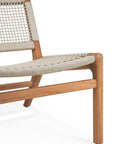A close-up of the Ethnicraft Jack Woven Outdoor Lounge Chair, showcasing its light wooden frame and Italian weave rope seat and backrest with clean lines and a minimalist design.