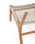 A close-up of Ethnicraft’s Jack Woven Outdoor Lounge Chair, showcasing its wooden frame and light Italian weave seat that emphasizes the craftsmanship and texture of the materials.