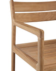 Close-up of the Ethnicraft Jack Outdoor Dining Chair - Teak, featuring solid teak construction with a smooth natural finish, armrest, and backrest visible against a white background. The design reflects classic European style.