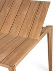 A close-up of Ethnicrafts Bok Outdoor Extendable Dining Table in natural teak, showcasing solid FSC-certified wood, clean lines, and a refined finish.