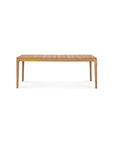 The Ethnicraft Bok Outdoor Extendable Dining Table in natural teak features a rectangular shape, slatted tabletop, and four slender legs, shown against a plain white background.