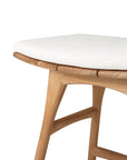 A close-up of the Osso Outdoor Stool by Ethnicraft, showing its smooth, rounded light wood frame and upholstered white seat cushion for a simple, elegant outdoor design.