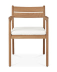 The Jack Outdoor Dining Chair - Teak by Ethnicraft is a solid teak armchair with a natural finish, slatted back, straight legs, and white cushioned seat. Its minimalist, modern design makes it perfect for outdoor dining spaces.