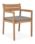 The Jack Outdoor Dining Chair - Teak by Ethnicraft features a light brown solid teak frame, straight legs, open sides, a horizontal slat backrest, armrests, and a cushioned flat seat covered in light gray outdoor fabric.