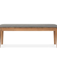 The Ethnicraft Bok Outdoor Bench - Natural Teak features four legs and a rectangular, gray fabric cushioned seat, crafted from solid teak and displayed against a plain white background.