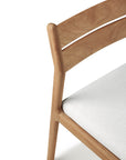 Close-up of the Ethnicraft Jack Outdoor Dining Chair - Teak (without armrest), featuring a curved backrest and light outdoor fabric seat in solid teak, shown against a white background.