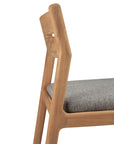A close-up of the Ethnicraft Jack Outdoor Dining Chair - Teak (without armrest), showing its angular backrest, side profile, and light gray outdoor fabric seat cushion.