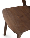 Close-up of Ethnicraft’s Bok Dining Chair - Brown Teak, highlighting its smooth, dark brown FSC-certified teak seat and legs with a clean, modern design.