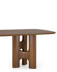 Ethnicraft Flow Dining Table | Teak Wild Brown featuring a rectangular solid wood top with rounded edges and a sculptural, hollowed-out pedestal base.