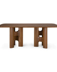 Ethnicraft Flow Dining Table | Teak Wild Brown featuring a rectangular solid wood top supported by two sculptural, curved pedestal bases.