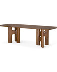 Ethnicraft Flow Dining Table | Teak Wild Brown featuring a rectangular solid wood top supported by two sculptural, H-shaped pillar legs.