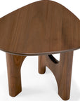 The Flow Side Table by Ethnicraft is a small, triangular wooden coffee table with rounded edges and three sturdy legs. Set against a white background, this piece evokes the timeless appeal of vintage modern furniture.