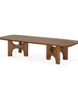 Ethnicraft Flow Coffee Table | Teak Wild Brown in solid wood, featuring a rectangular top with rounded edges and two sculpted, arched bases.