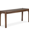 The Pi Bench - Teak by Ethnicraft features a sleek, minimalist design with rounded edges, four sturdy legs, and a smooth dark brown teak finish inspired by classic European refinement.