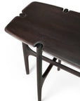 The Ethnicraft PI Console in dark brown teak features smooth, rounded edges and unique carved notches at the corners, crafted from FSC-certified wood with slender, curved legs and crossbars, shown from an angled overhead view.