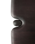 Close-up of two smooth, dark brown teak panels from the Ethnicraft PI Console, positioned vertically with an oval-shaped protrusion fitting into a curved indentation, set against a white background.