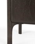Close-up of the leg and corner of the Ethnicraft PI Sideboard in teak, highlighting its smooth, rounded edges and visible wood grain against a white background. Available in 3 sizes.