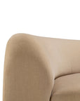 Close-up of the Ethnicraft Bulky Modular Sofa - Light Sepia, featuring soft, rounded edges and luxurious upholstery with a curved backrest and seat, shown against a white background.