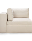 The Ethnicraft Mellow Modular Sofa in off white features a left armrest and plush back cushion, upholstered in stain-resistant Italian fabric, shown side view against a white background.