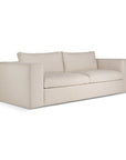 The Ethnicraft Mellow Sofa - Off White features a minimalist, contemporary design with thick square armrests and two seat cushions, made from recycled cotton, shown against a white background.