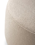 Close-up of the large Barrow Pouf in Off White by Ethnicraft, featuring textured upholstery with visible stitching, shown against a white background.