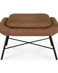 The Ethnicraft Barrow Footstool in Copper is a modern brown ottoman inspired by vintage design, featuring textured fabric, rounded edges, and black metal legs with an X-shaped support.
