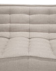 Close-up of the Ethnicraft N701 2-Seater Sofa in beige, featuring a tufted fabric upholstery with a textured surface and horizontal stitching on the backrest and seat, exemplifying exceptional European craftsmanship.