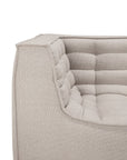 Close-up of the N701 2-Seater Sofa by Ethnicraft in beige, featuring a quilted, cushioned texture and clean, angular lines that highlight its modular design inspired by European craftsmanship.