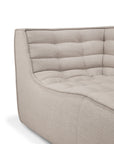 Close-up of the N701 2-Seater Sofa in Beige by Ethnicraft, showcasing a quilted, tufted backrest and seat with clean, soft lines and textured upholstery—highlighting exceptional European craftsmanship and a sophisticated modular design.