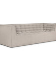 A contemporary, rectangular Ethnicraft N701 3-Seater Sofa in beige, featuring tufted seat and back cushions, softly rounded corners, and a minimalist European design, shown against a white background.