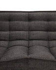 Close-up of the Ethnicraft N701 2-Seater Sofa in dark grey, featuring tufted fabric upholstery with horizontal and vertical seams on the seat and backrest, set against a plain white background. Inspired by European design, this sofa blends elegance with contemporary comfort.