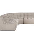 The N701 Modular Sofa - Ecru (Eco Fabric) by Ethnicraft features a modern curved design, tufted ecru upholstery in stain-resistant eco fabric, a low backrest, and minimalist clean lines.