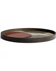 The Overlapping Dots Tray (Round/Large) by Ethnicraft features a glossy dark wood finish with abstract, translucent silhouettes in brown, beige, and maroon that resemble overlapping shapes or a landscape on a white background.