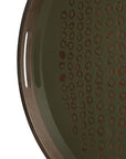 A close-up of the Ethnicraft Second Nature Tray, featuring a round wooden design, a cutout handle, and a hand-printed glass surface with an irregular, spotted animal print pattern.