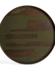 The Ethnicraft Second Nature Tray is a round tray with a dark brown wooden rim and base, featuring abstract olive green patterns as part of the Second Nature collection.
