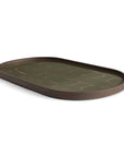 The Ethnicraft Second Nature Tray features a dark brown oval shape, raised edges, and a glossy olive-green hand-printed glass surface with an abstract gold line design.