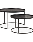 The Ethnicraft Tray Coffee Table - Set of 2 features modern round black tables with thin metal legs and raised edges, ideal for versatile spaces and inspired by the Tray Collection’s sleek design.