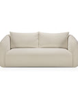 The Ethnicraft Figur Sofa | 2 seater is a modern piece in light beige, featuring rounded armrests and two generous back cushions. Shown from the front against a white background, it serves as an ideal centerpiece for contemporary living spaces.