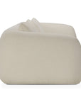 Side view of a modern, cream-colored, low-profile armchair with rounded edges and a smooth, minimalist design—perfectly complementing the Ethnicraft Figur Sofa | 2 seater in any contemporary living space.