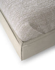 Close-up of an Ethnicraft Revive Bed - Sand cushion with 100% linen covers, showing its smooth fabric base, soft ribbed top surface, and detailed stitching.